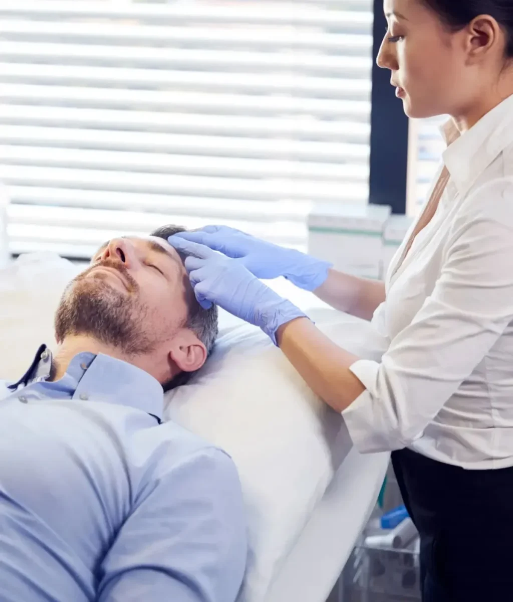 female-beautician-giving-mature-male-patient-botox-treatment