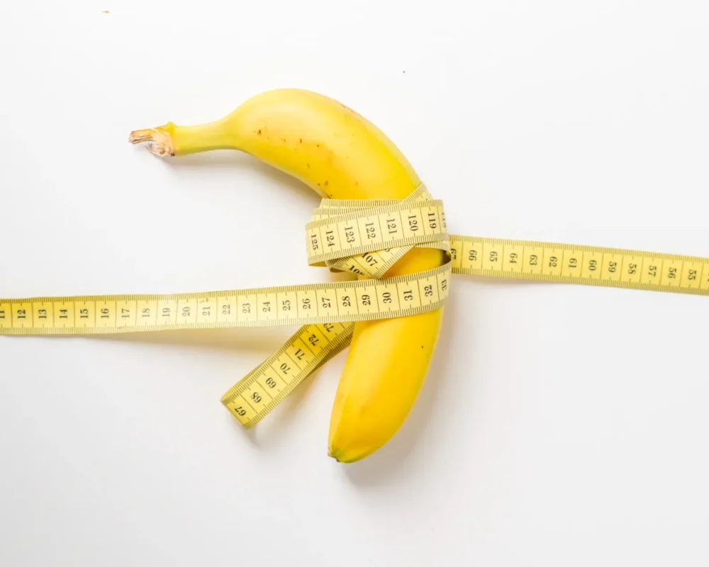 fruit-and-centimeter-tape-on-white-surface