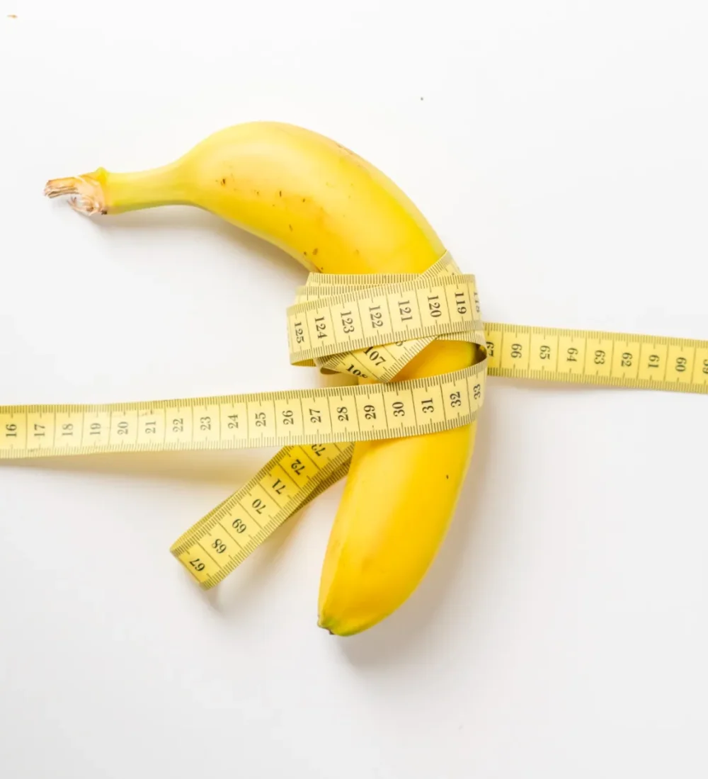 fruit-and-centimeter-tape-on-white-surface