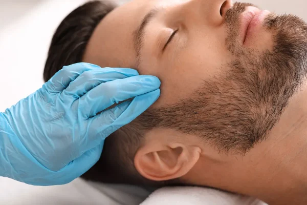 man-getting-beauty-treatment-against-eye-wrinkles